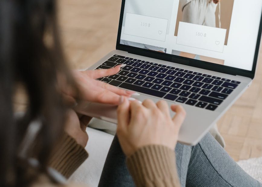 a woman browsing on a laptop