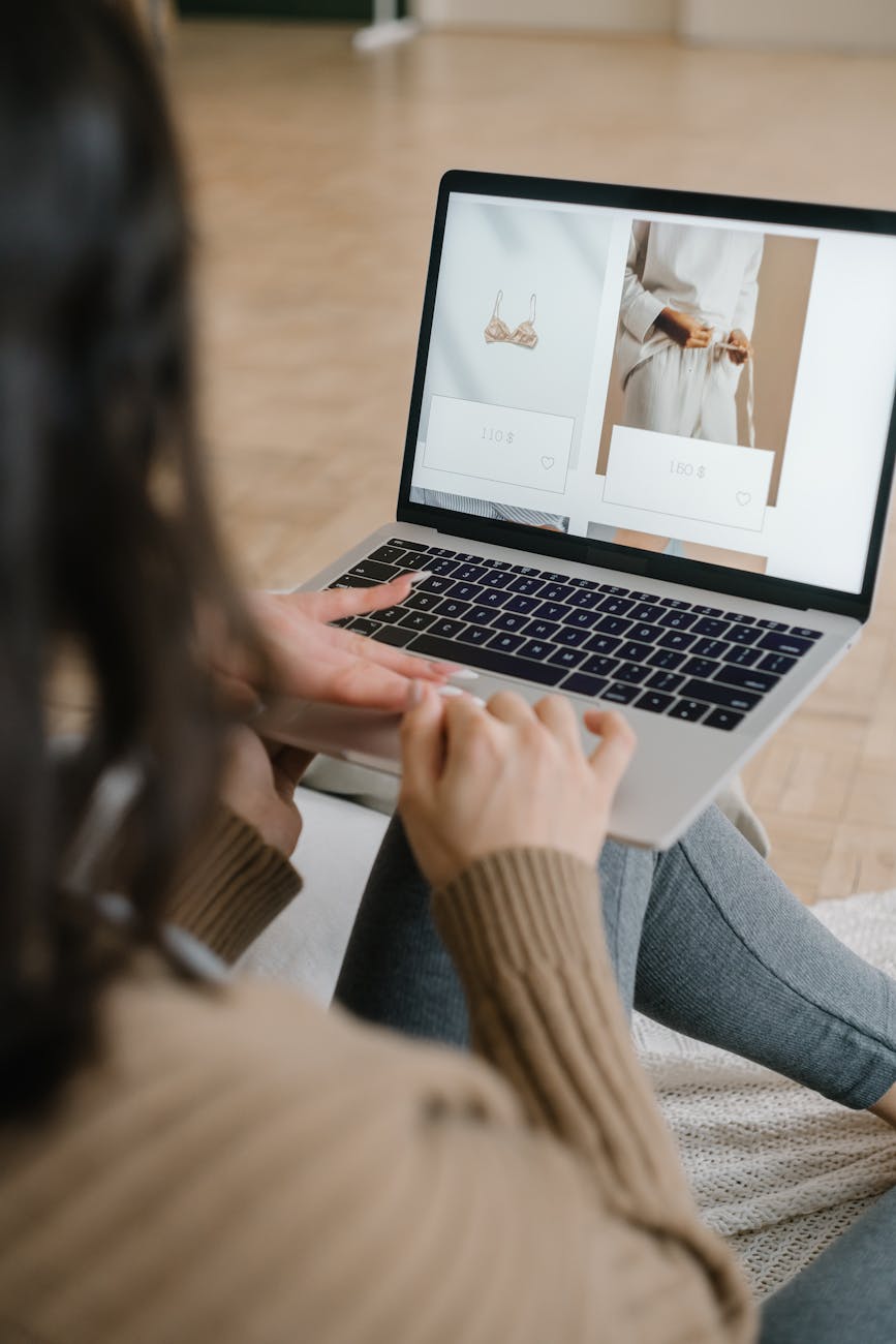 a woman browsing on a laptop