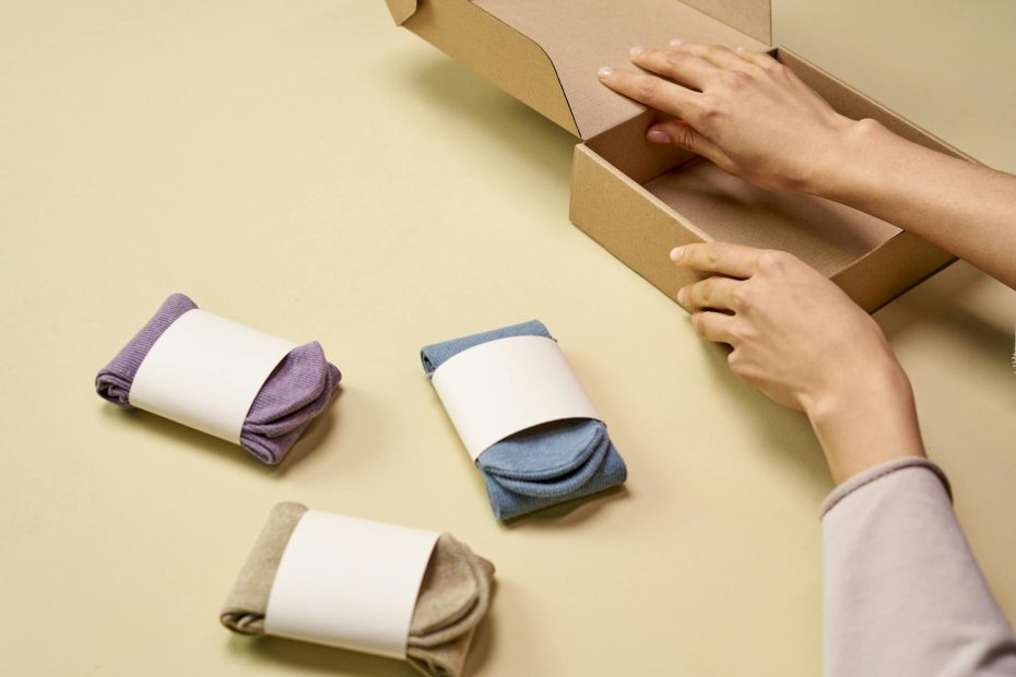 a person preparing a cardboard box packaging