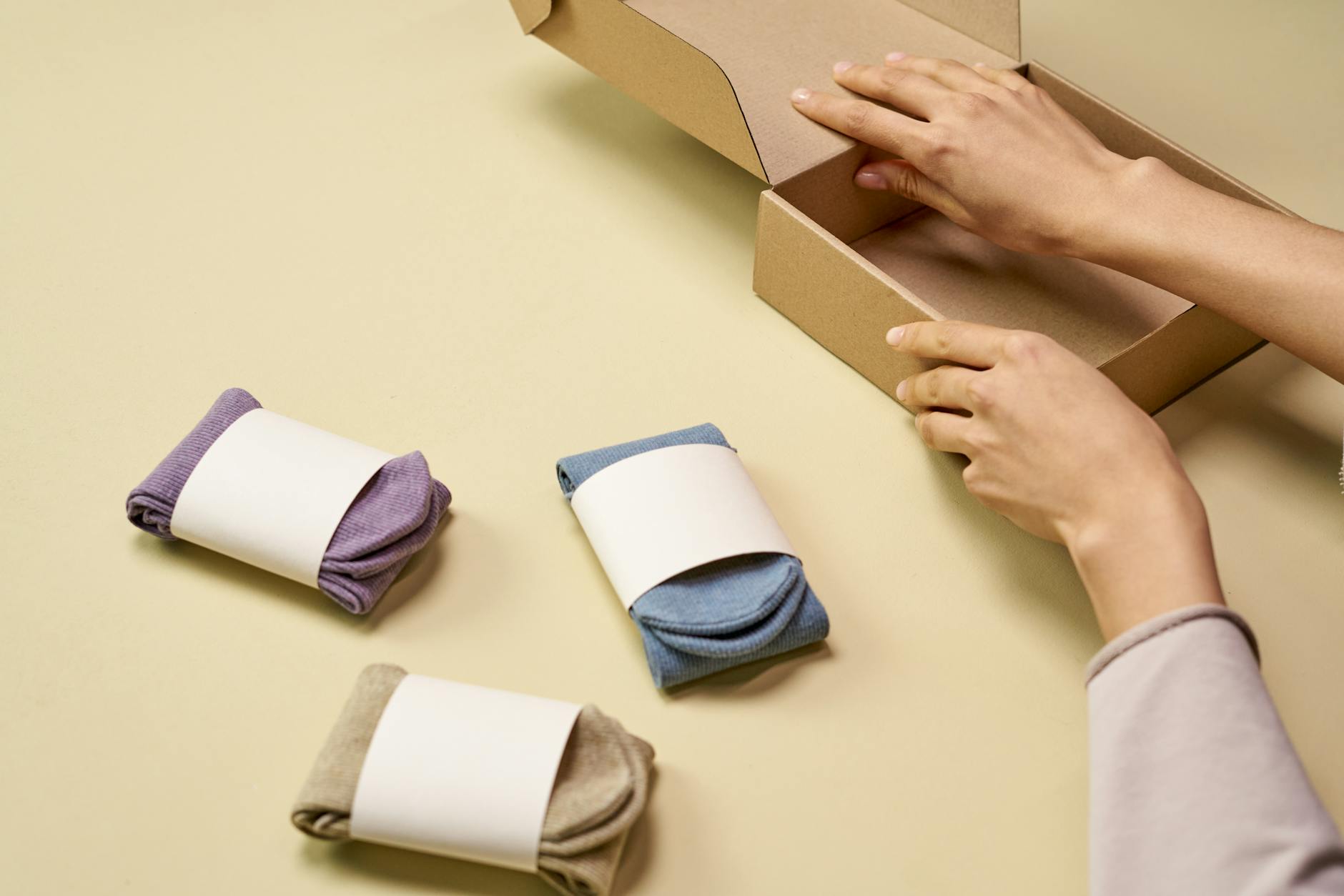 a person preparing a cardboard box packaging